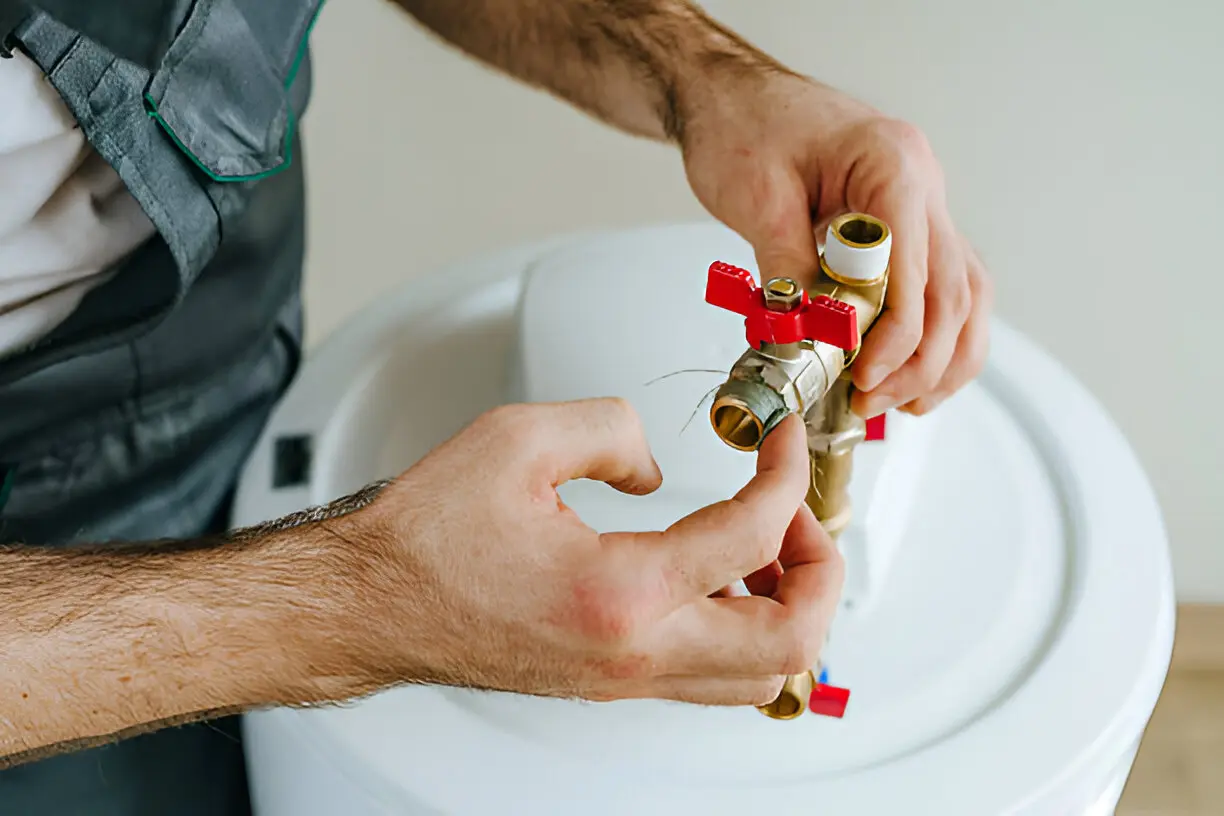 Technician providing heating system service for a central furnace in Orlando home